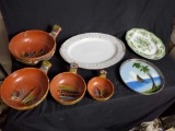 2 vintage serving platters. Set of 4 unique pottery bowls. 1 small decorative silver rim plate.