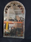 Vintage mirror with floral engraved edges and felt back.