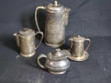 International silver co. pitcher and 3 small pitchers.