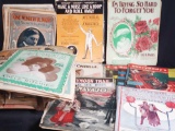 Box of vintage magazines and music composition sheets.