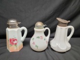 Three early 20th century Milkglass Syrup pitchers