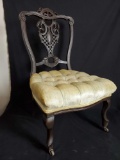 Vintage dark wood frame chair with upholstery seat.