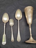 Silver spoons and cup