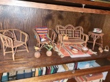 Shelf of Doll size furniture and Mexican pottery