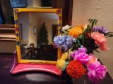 Cute painted mirror and artificial flowers