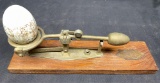 Antique tin egg scale made by the Reliable Mfg. Co