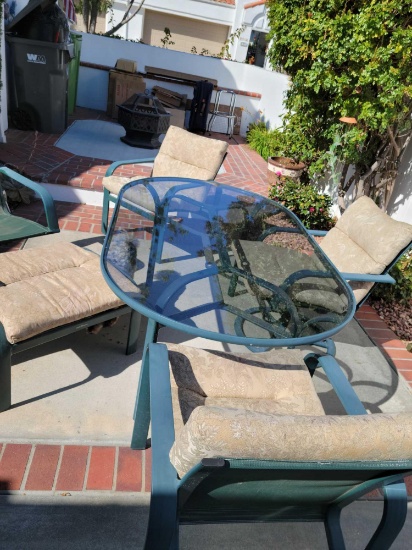 Patio set Four Chairs ottoman glass top table and real wood fire pit