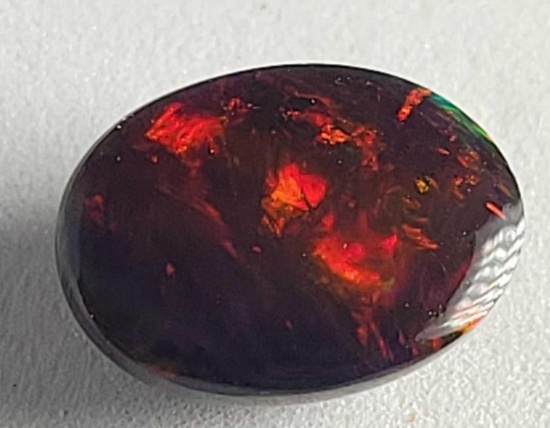 Oval cut Black Opal stunning color 1.90ct