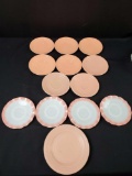 13 vintage pink saucer plates.