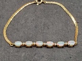 6 bar opal 14k gold bracelet with small diamonds