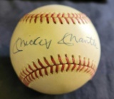 Baseball with signature saying Mickey Mantle