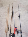 lot of fishing poles and fly rods