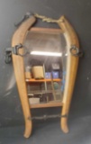 Unique western horse shoe shaped mirror and vintage saw located Escondido