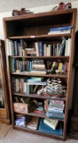 large bookcase books brass geese ship etc