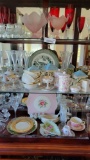 Contents of China hutch Fine china pieces Crystal