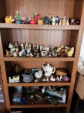 Bookcase contents - Porcelain figurines Die Cast Cars Coin Bank Pottery