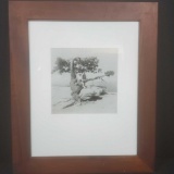 Framed black and white photo of people/unique tree