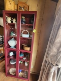 tall display case with contents