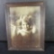 Framed antique black and white photo titled Cupid awake 1897