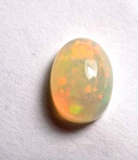 Opal Australian rare natural rainbow wow gem oval with nice fire 1.5 ct