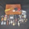 wood box of watches pins knives lighters