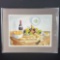 Framed artwork fruit wine bread on table