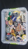 Small bin of sports pins Keychains magnets bottle openers etc.