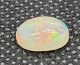 oval cut Ethiopian opal gemstone beautiful red and green rainbow colors 1.41ct