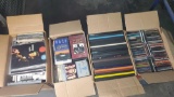 4 boxes containing Cds vintage records vhs tapes books/programs etc.