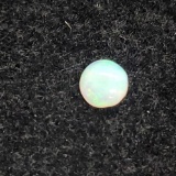 Round cut cabochon Opal .13 ct.