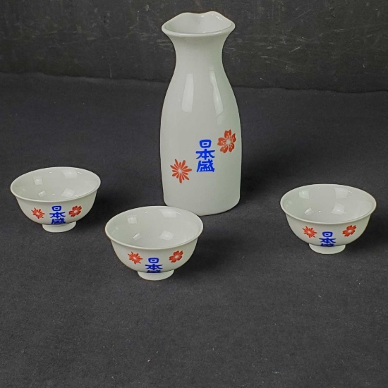 Small vintage porcelain decanter with 3 small cups made in Japan