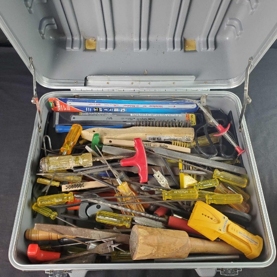 Hardcase bin full of handtools wire brushes hacksaw blades dril bits wrasps etc.