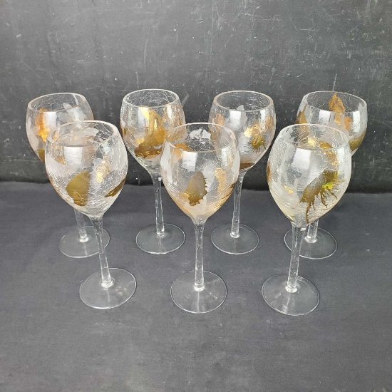 Lot of 7 crystal with gold colered wine glasses