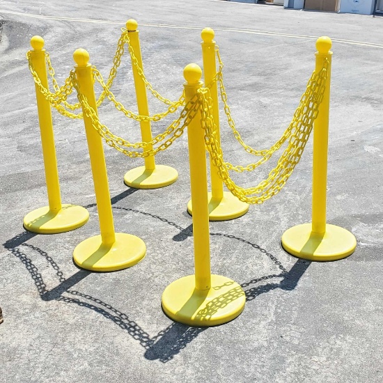 Various Yellow plastic stanchions with plastic yellow chain
