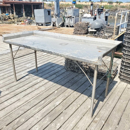 Stainless steel table 38in tall 75in wide 30in depth
