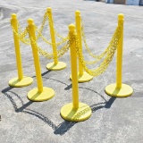 Various Yellow plastic stanchions with plastic yellow chain