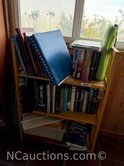 bookshelf and its contents some comic books