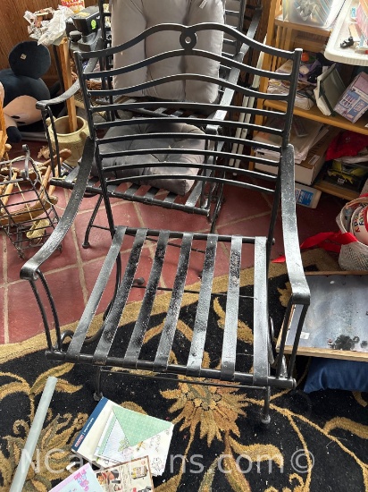 four matching cast-iron patio chairs
