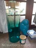 turquoise statue, decorative lamps, vases, books