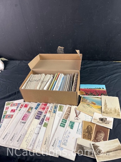 box full of vintage postage stamps post cards and photos