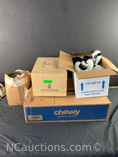 boxes full of ceramic collectibles stuffed animals wooden duck etc