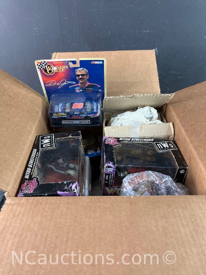 box of die cast cars and ceramics
