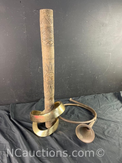 Sun instrument statue and a brass bugle