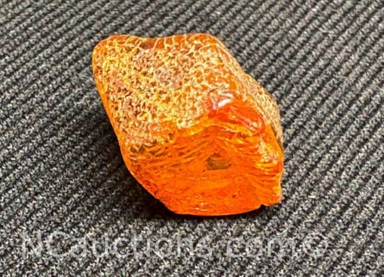Amber piece 1.07 grams. Quarter for size reference only.