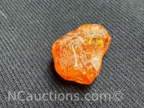 Amber piece 0.88 grams. Quarter for size reference only.