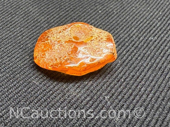 Amber piece 1.17 grams. Quarter for size reference only.
