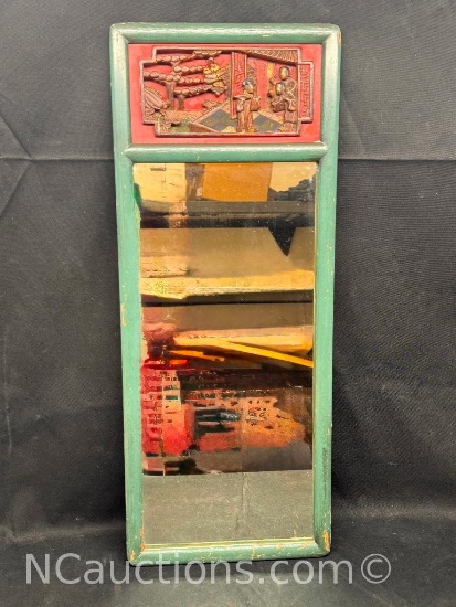 Mirror with Asian carved frame green border with red lacquered scene of a guest entering a house