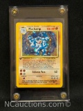 Vintage WOTC Rare Machamp Cosmos Holo 1st Edition Pokemon Card