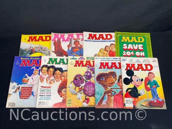Nine vintage Mad magazines Mickey Mouse ET Superman etc.