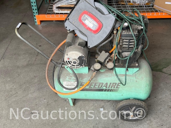 Portable Speedaire electric air compressor with a horizontal tank